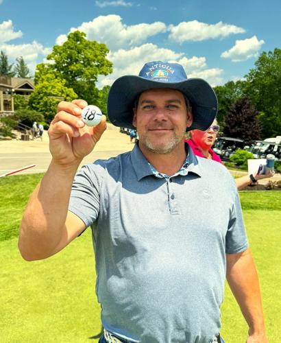 Geneva Lake West Rotary Club 50/50 Putting Challenge winner Brian Wheatland