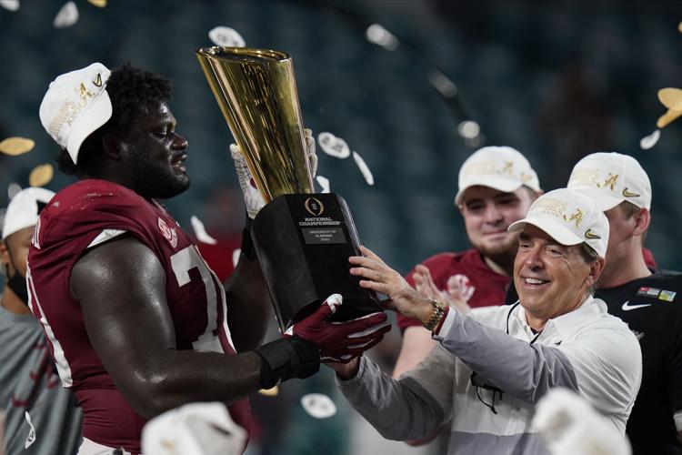 Nick Saban, Alabama, with trophy, AP photo