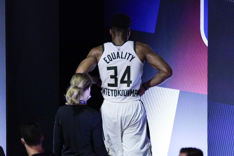 Giannis Antetokounmpo leaves court, AP photo