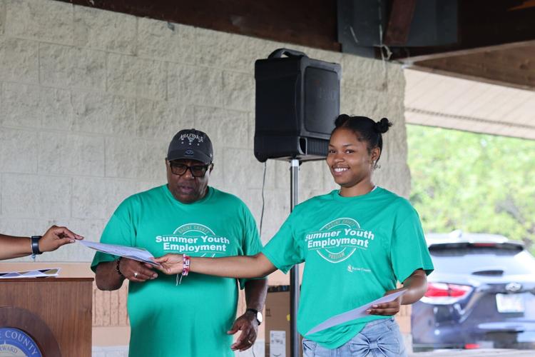 Amariah Hatley accepts program completion certificate