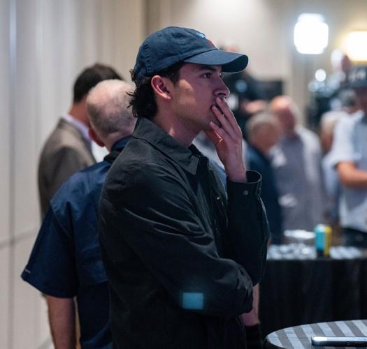 Noel Morales of Milwaukee watches vote totals come in as supporters gather for Democratic gubernatorial candidate and Milwaukee