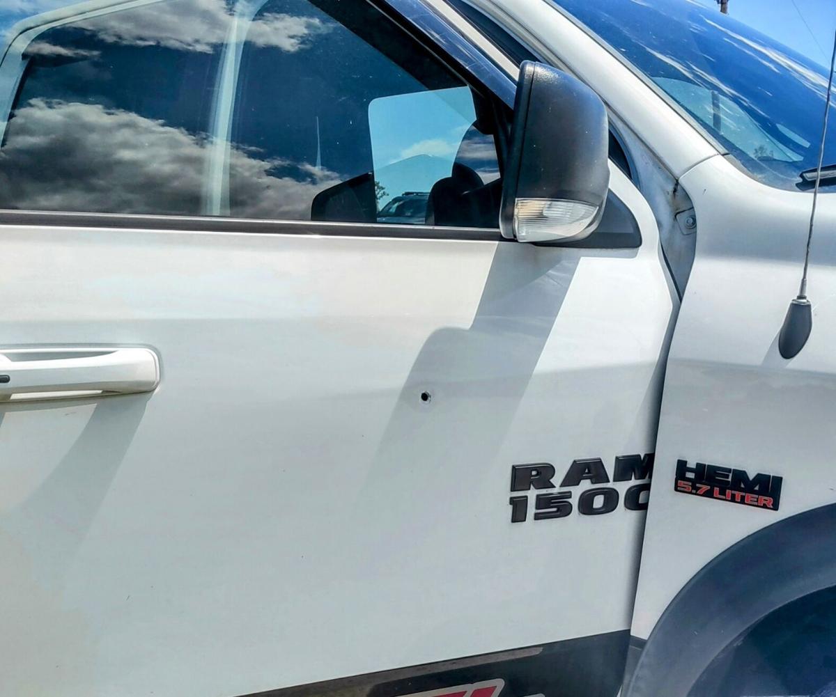Stray bullet penetrated pickup truck door May 25