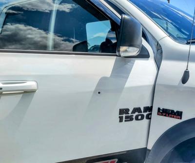 Stray bullet penetrated pickup truck door May 25