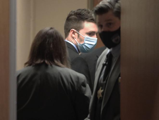 Led out of courtroom