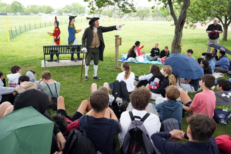 Professional Storyteller Jonathan Kruk presents local Revolutionary War era history to seventh-graders from Hommocks Middle