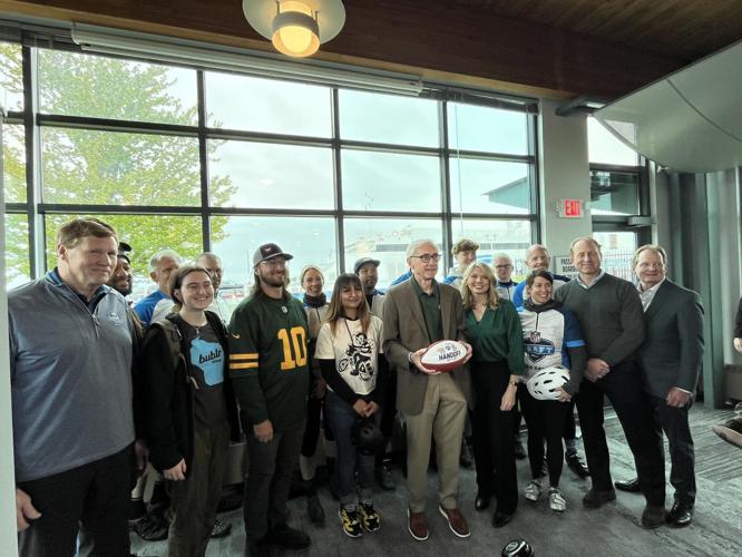 NFL Draft football hand-off on May 14 in Milwaukee