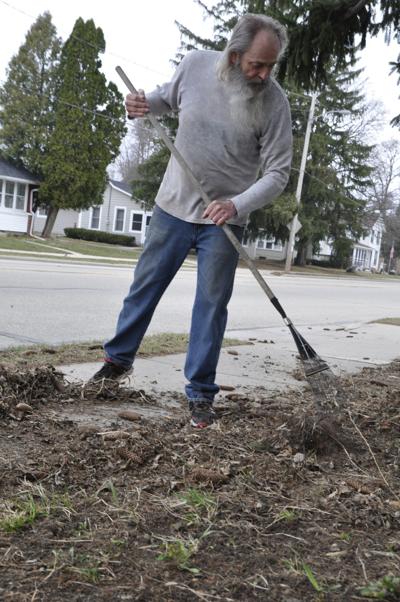 Bill Robers does yard work on Williams Street