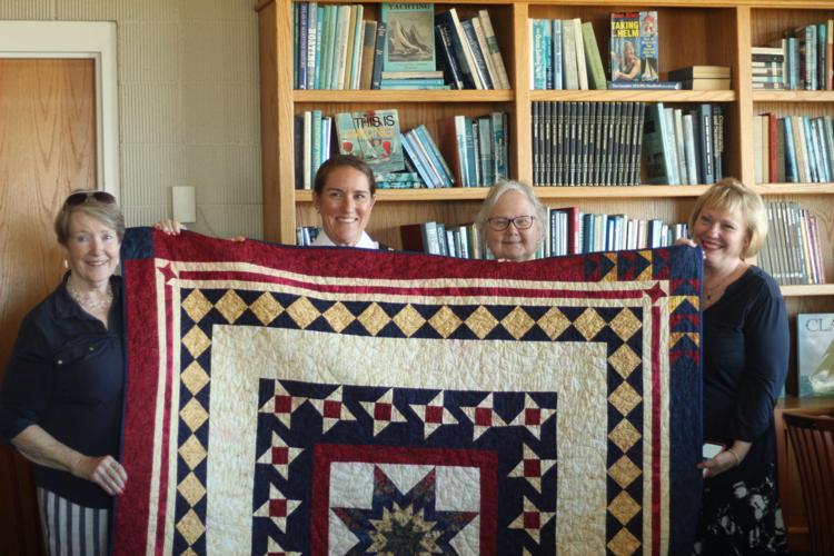 Group Photo with Major Gretchen Gaskins and her quilt