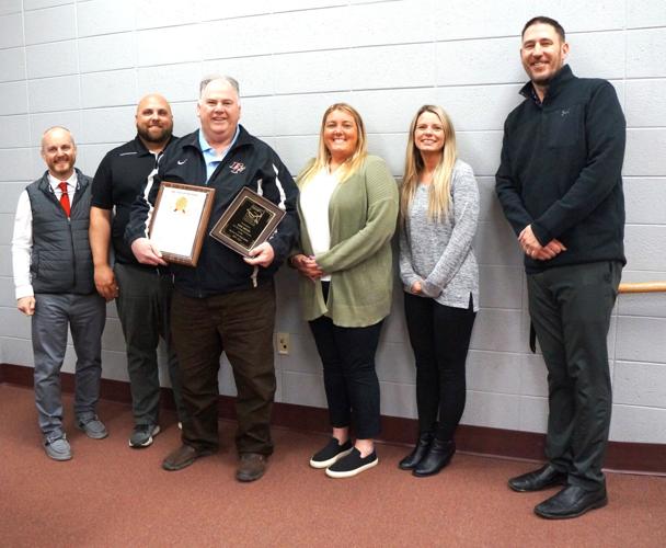 Retiring 21-year Big Foot School Board member Kim Artnz congratulated by school administrators
