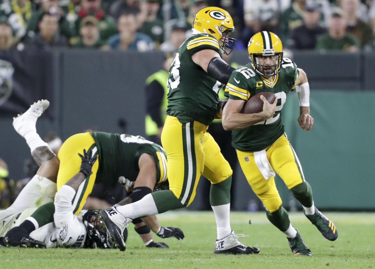 Aaron Rodgers runs, State Journal photo