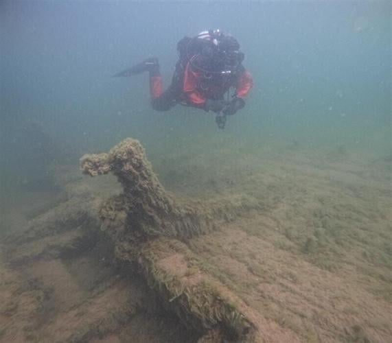 A diver approaches the Frank D. Barker, a vessel lost in Lake Michigan in 1887.