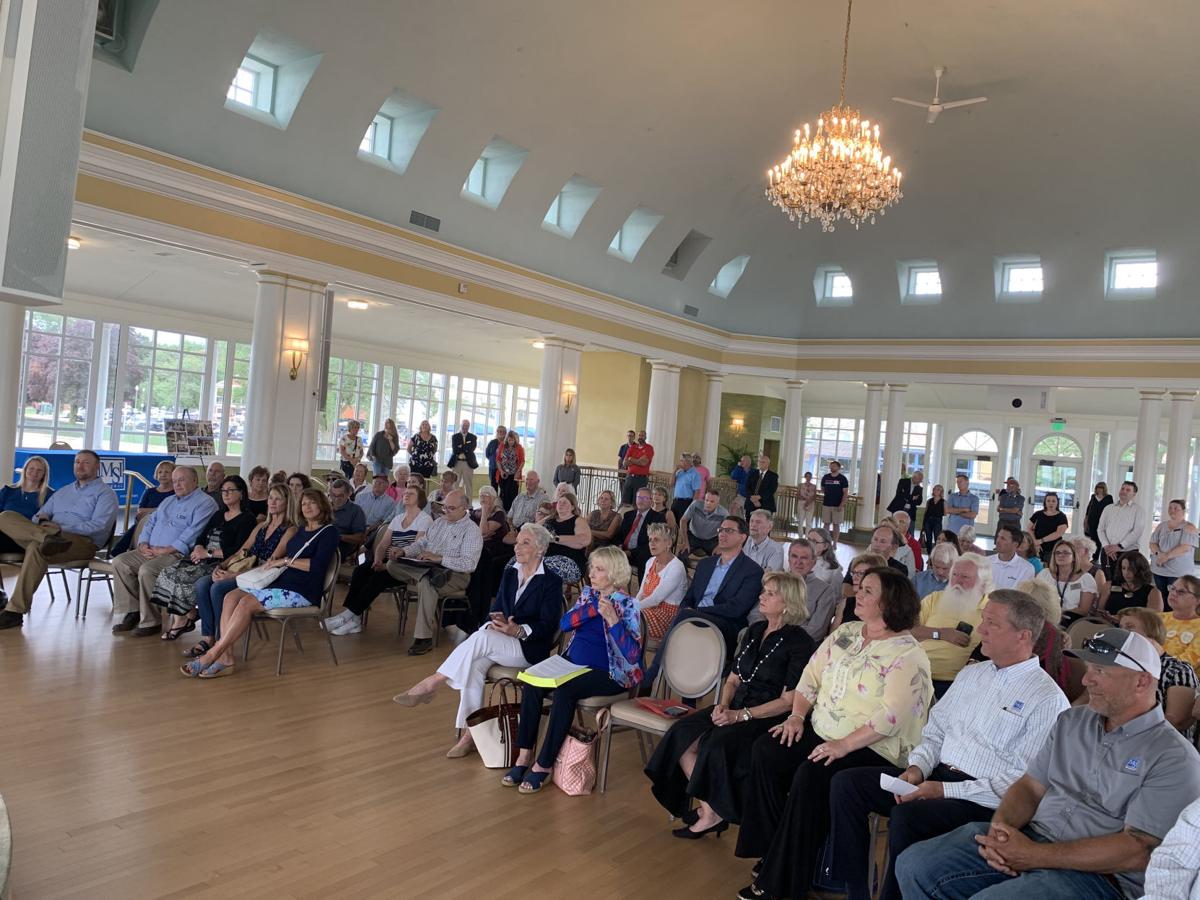 A crowd of people attend the Riviera dedication ceremony, July 15
