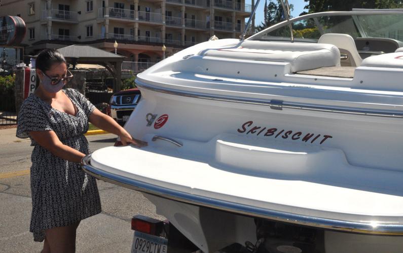 Chrissy Bell of Minneapolis stages her boat as she prepares for a day on the water on Geneva Lake