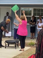 Homeowner holds mortgage burning ceremony