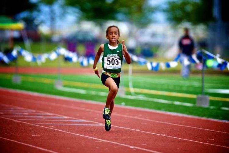 little girl running a race