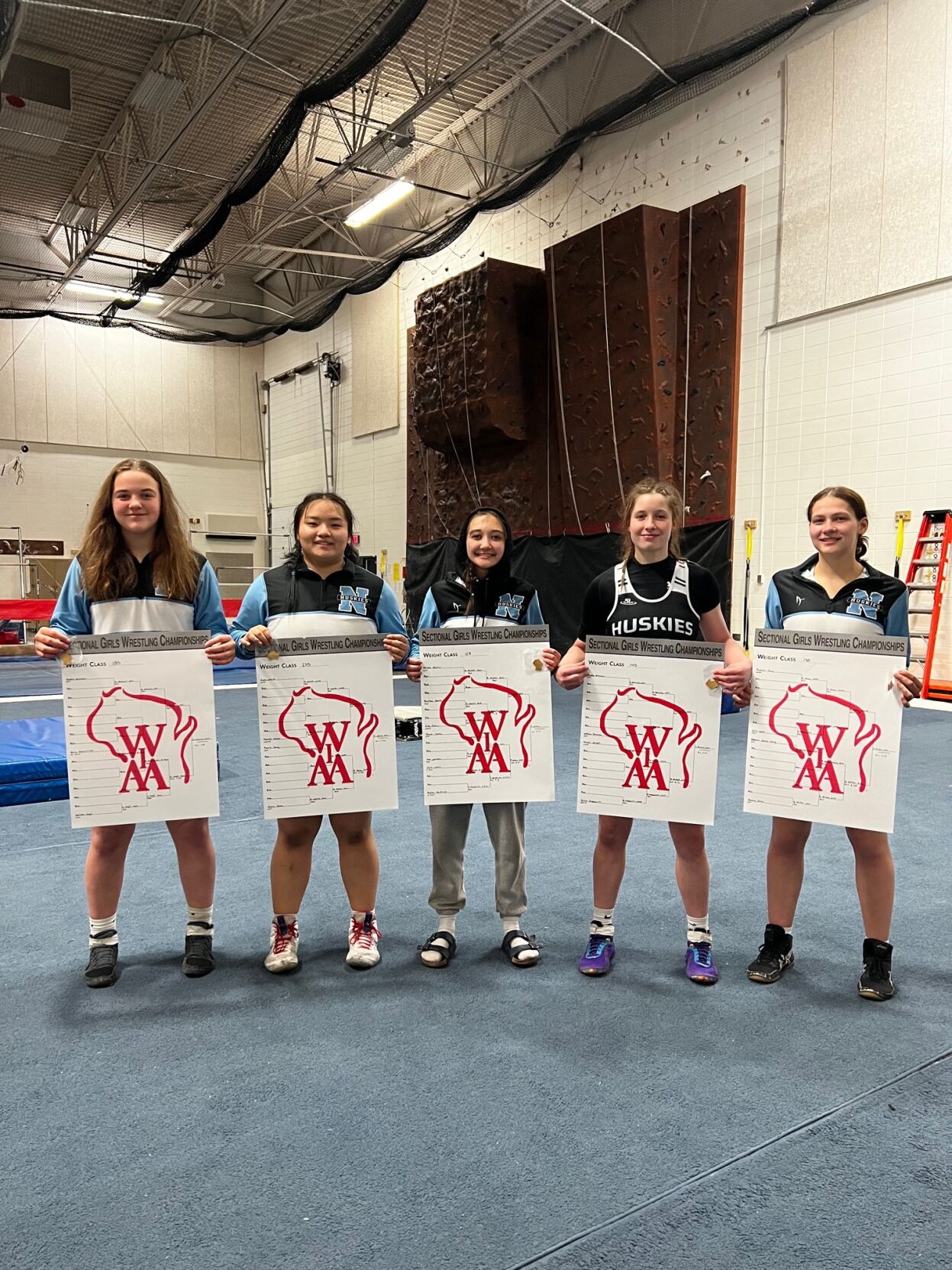 North Girls Wrestling Team Dominates WIAA Sectional, Five Qualify for State Tournament