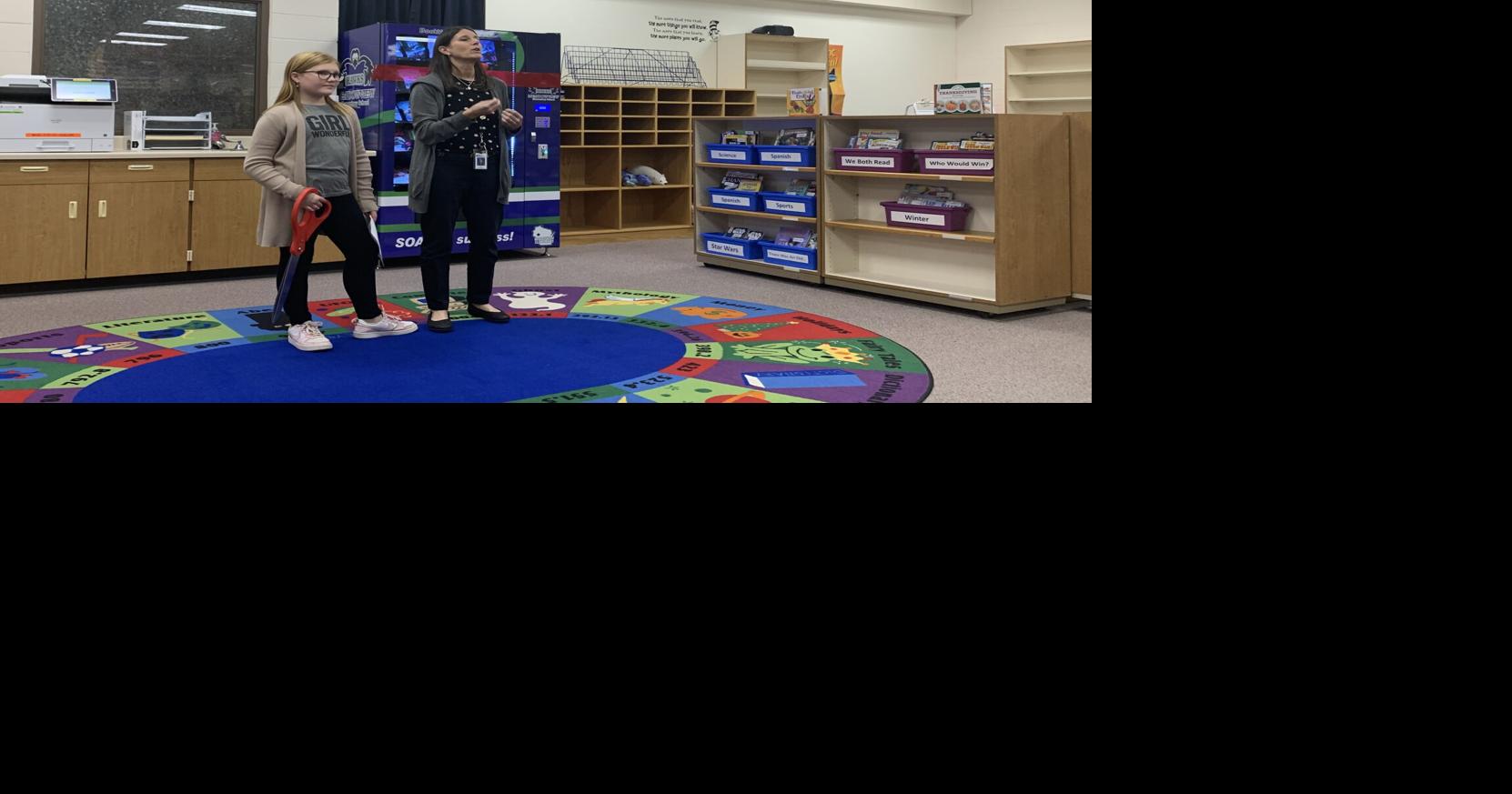 Meadowview Elementary cuts ribbon on book vending machine to promote ...