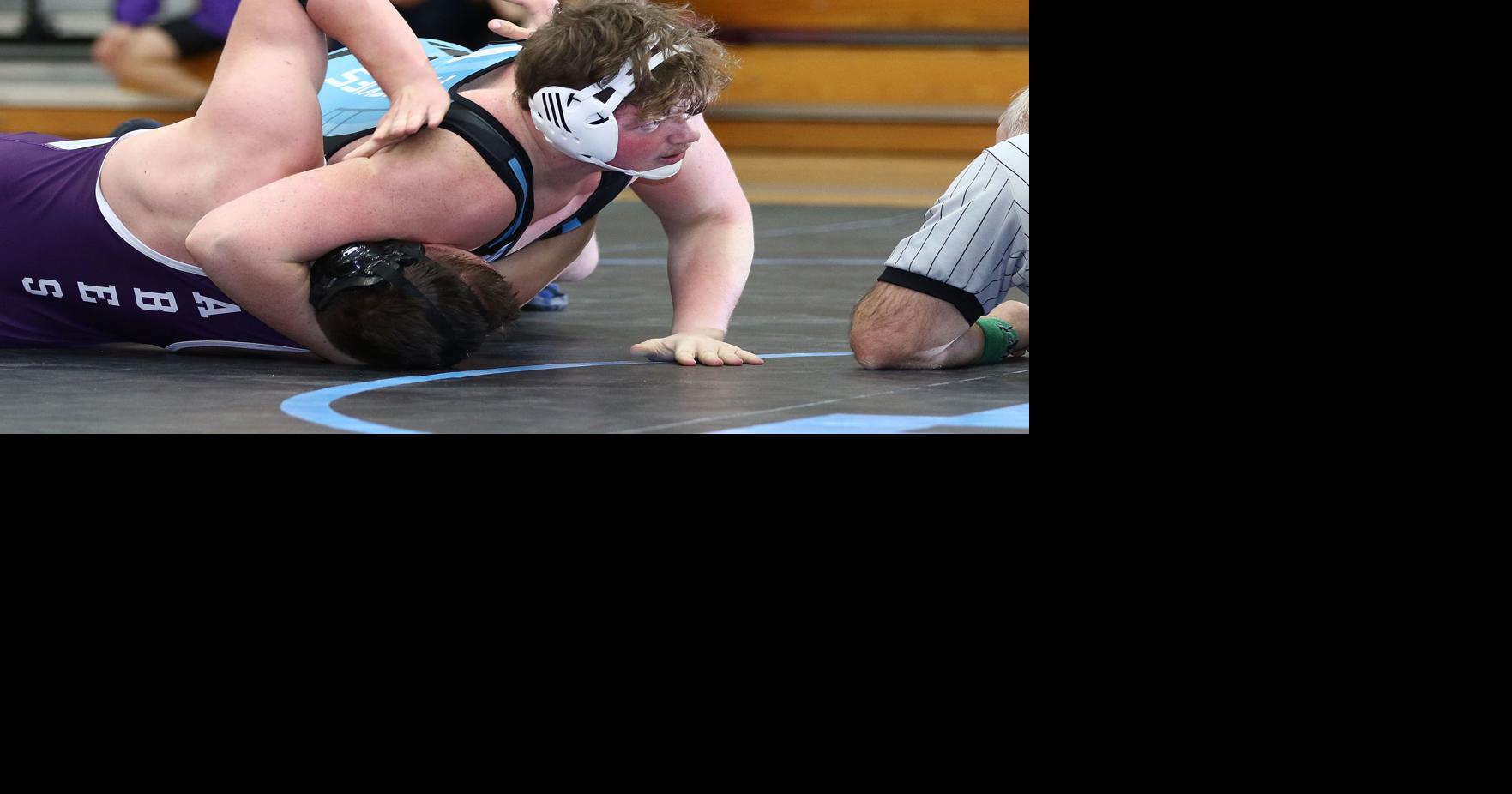 Prep wrestling North gets three straight pins to seal victory against