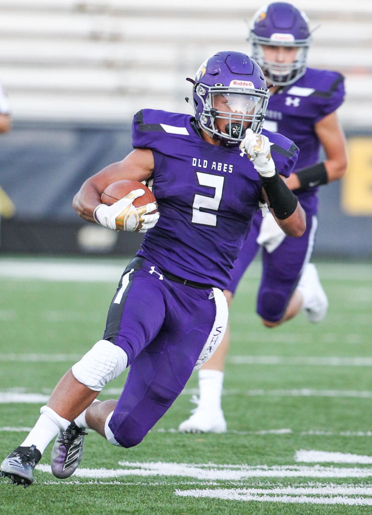 Prep Football: Crawford sets Old Abe rushing record in Central shootout