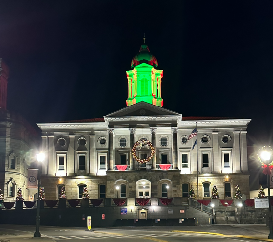 Courthouse illuminated in Christmas-themed colors