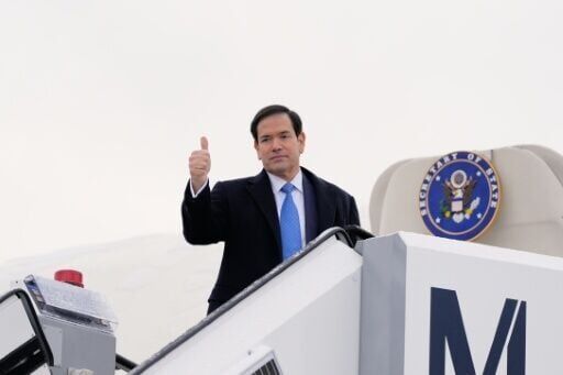 US Secretary of State Marco Rubio gives a thumbs up as he departs Munich International Airport