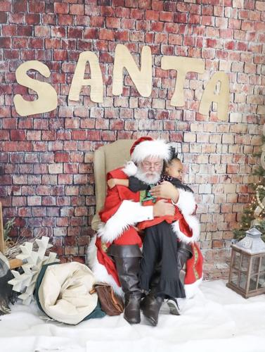 Downtown Alliance holds Santa Saturday gives free pictures of Santa