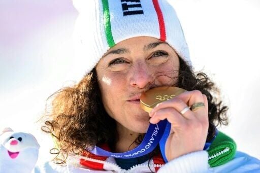 Federica Brignone celebrates winning her second gold medal of the 2026 Winter Olympics with her giant slalom triumph