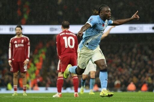 Manchester City's Jeremy Doku celebrates scoring against Liverpool