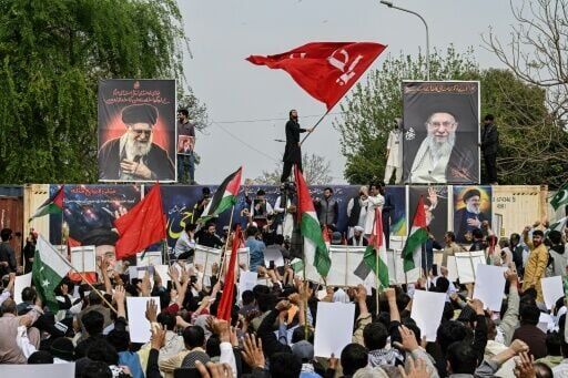 Shia Muslims holding portraits of Iran's slain supreme leader Ayatollah Ali Khamenei take part in an anti US-Israel protest in Islamabad on March 6, 2026