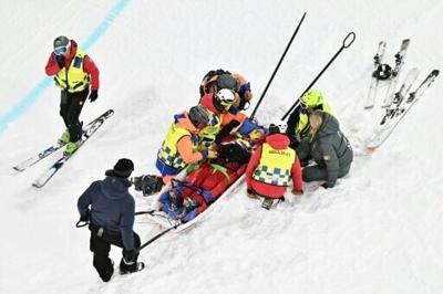 Canada's Cassie Sharpe receives medical assistance after crashing in the Olympic women's freeski halfpipe event
