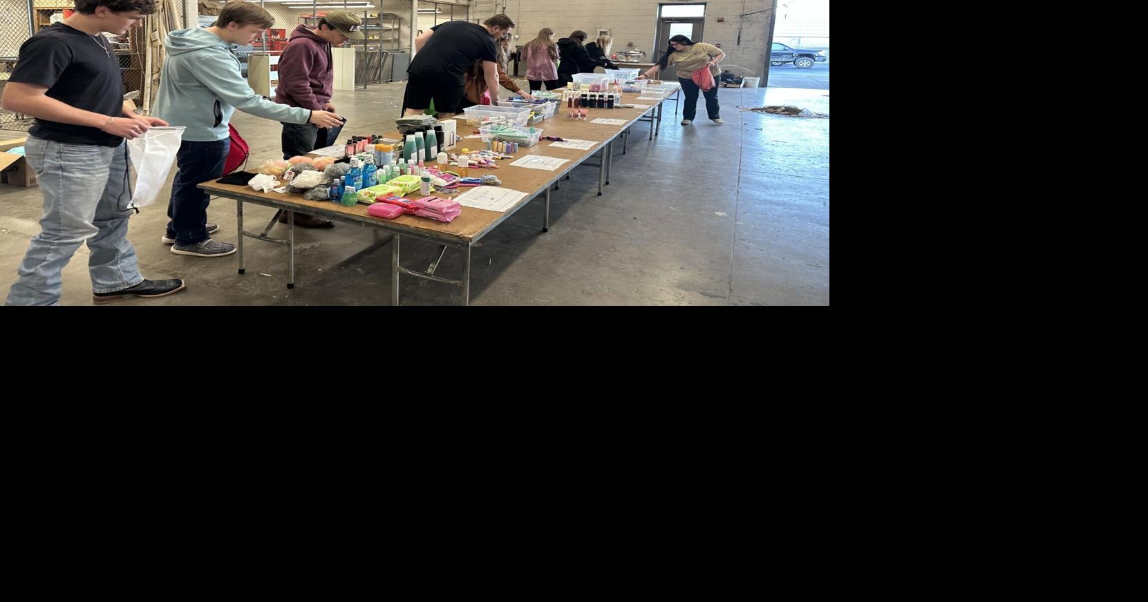 Students pack backpacks for children in foster care