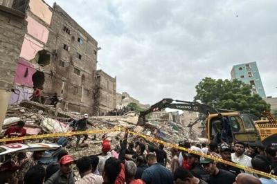 Rescuers and city residents worked together to pull people from the debris of the rundown building in the mega port city of Karachi