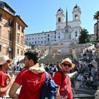 At open-air Church party, many thousands of young Catholics eagerly await pope