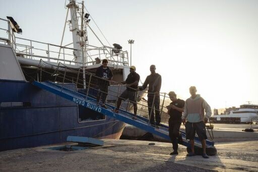 Indonesian nationals Surono (right), Rizal Harun (2nd right) and Wahyudin (left), with Angolan nationals Jose Viti (3rd left) and Pedro (2nd left), crew members of the tuna longliner fishing vessel Novo Ruivo