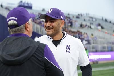 Christian Sarkisian, general manager of Northwestern athletics, greets a colleague before a Northwestern-Colorado football game Sept. 19, 2026, at Martin Stadium in Evanston, Illinois.