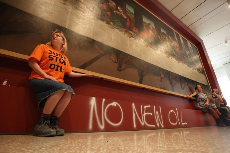 Activists glue themselves to copy of Leonardo's 'The Last Supper,' adding to string of similar protests