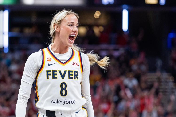 Aug 11, 2026; Indianapolis, Indiana, USA;  Indiana Fever guard Sophie Cunningham (8) celebrates a made shot in the second half against the New York Liberty at Gainbridge Fieldhouse. Mandatory Credit: Trevor Ruszkowski-Imagn Images