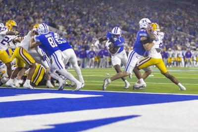 Kentucky Wildcats running back CJ Baxter runs the ball during overtime in a game against the Louisiana State Tigers at Kroger Field in Lexington, Ky., on Saturday, Oct. 10, 2026.