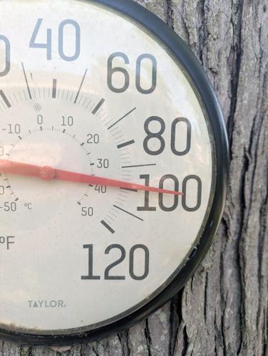 The heat approaches 100 degrees Fahrenheit on a residential thermometer in Farmingdale, New Jersey, on July 1, 2026.