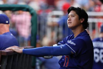 Los Angeles Dodgers two-way player Shohei Ohtani (17) looks on from the dugout during the fifth inning Philadelphia Phillies at Citizens Bank Park on Jul 22, 2026.