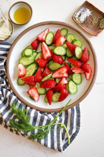 Strawberry-Cucumber salad has tons of flavor, fresh herbs, and no dressing to contend with.