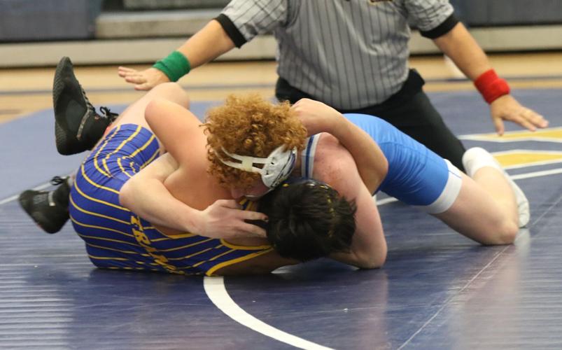 Overton wrestling at Elm Creek trianuglar