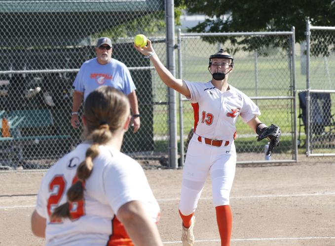 Taylor Shively throws to first