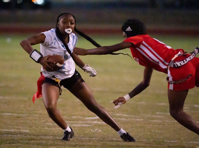 Oct. 2, 2025; Tuscaloosa, Alabama, USA; Northridge's Jiayiah Lee (2) tries to evade a flag pull by Central's Alaysha Merriweather (5) at Central High School.