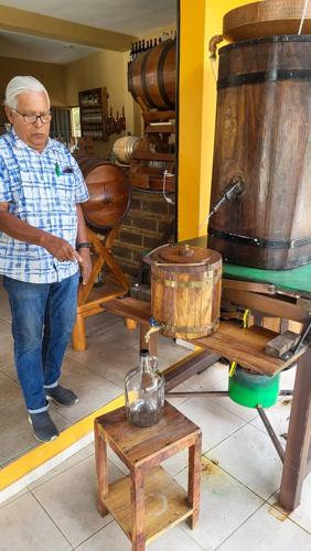Jorge Velazco Rocha runs an artisanal project of distilling tuba to make palm liquor at his roadside tavern near the town of Comala.