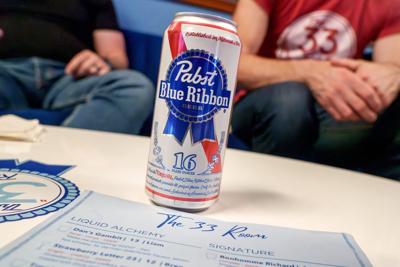 A 16 oz. can of Pabst Blue Ribbon Beer sits on a table at The 33 Room, a bar in the Pabst Brewing Company’s former headquarter