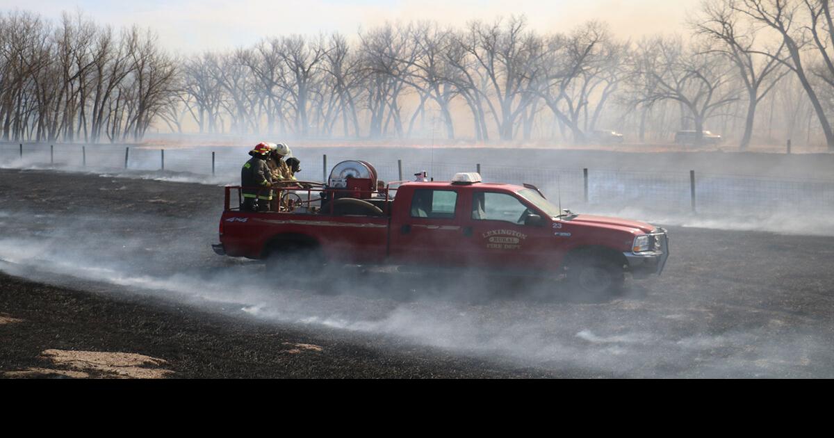Three fire departments battle multiacre wildfire that shut down I80