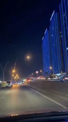 An explosion in the sky from a drone interception, in Erbil