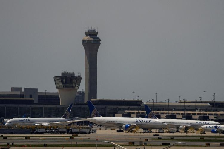 FILE PHOTO: The control tower is pictured as planes are seen on the tarmac at Newark International Airport in Newark, New Jersey