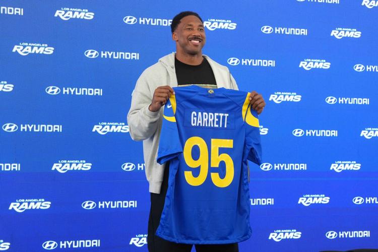 Los Angeles Rams defensive end Myles Garrett (95) poses with jersey at press conference at Rams Practice Facility.